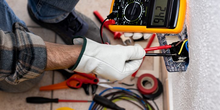 Technician fixing Waxahachie home’s HVAC