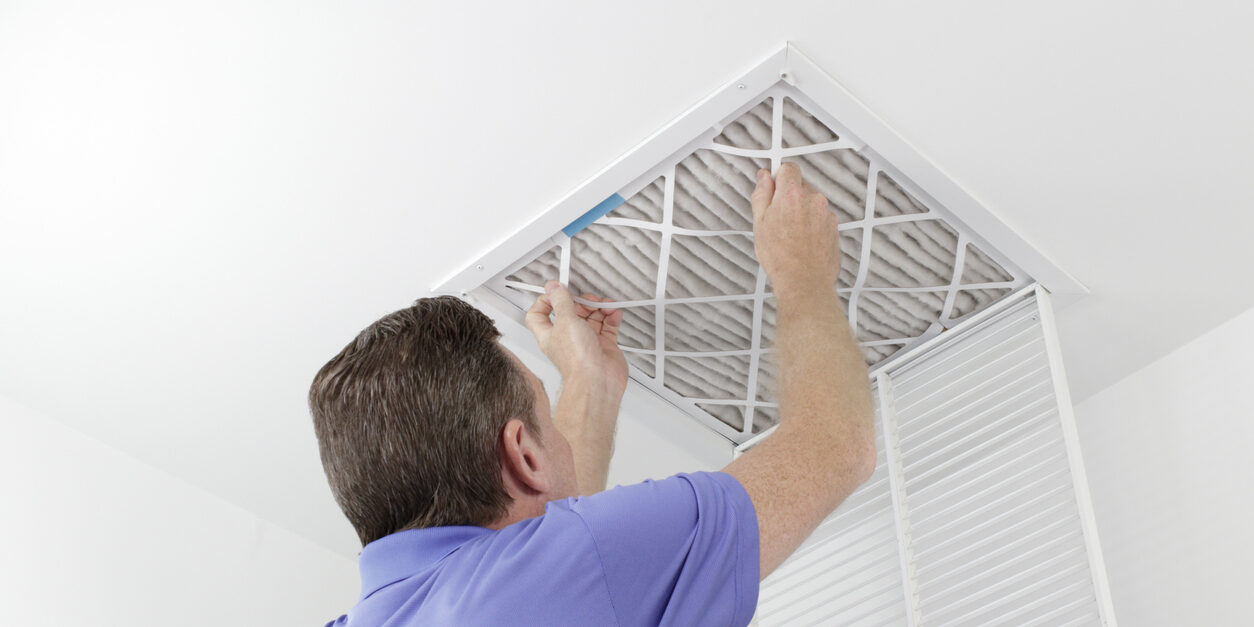 Person Removing Ceiling Air Filter air filter replacement