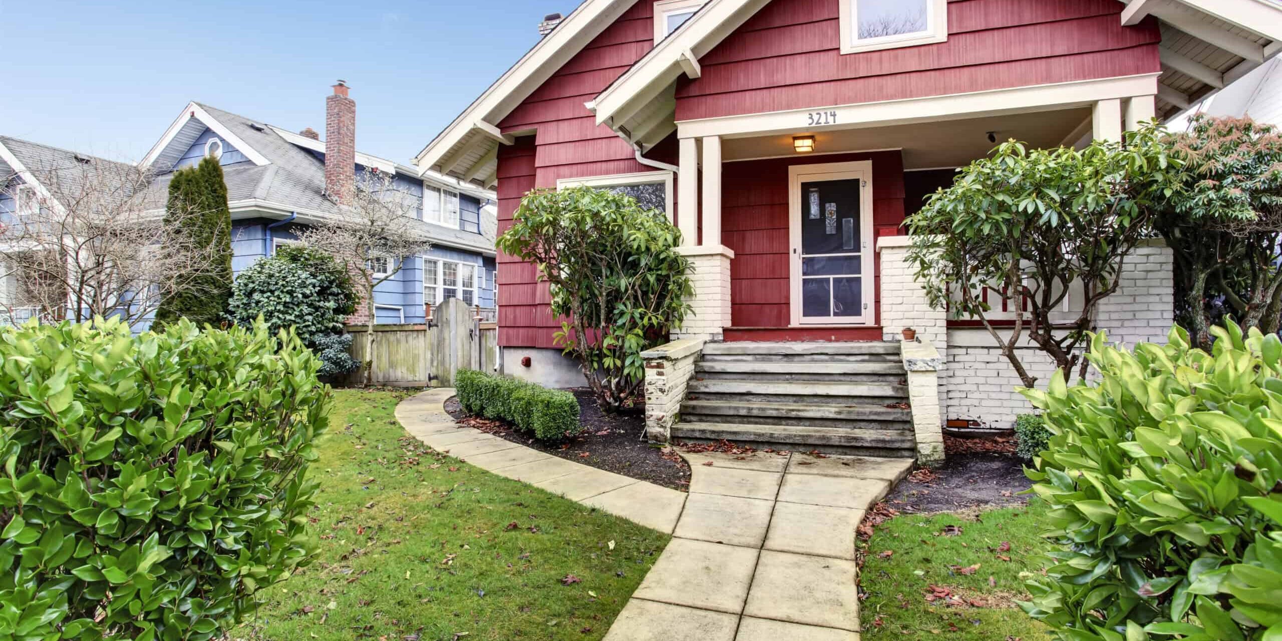Classic craftsman old American house exterior in red and white.